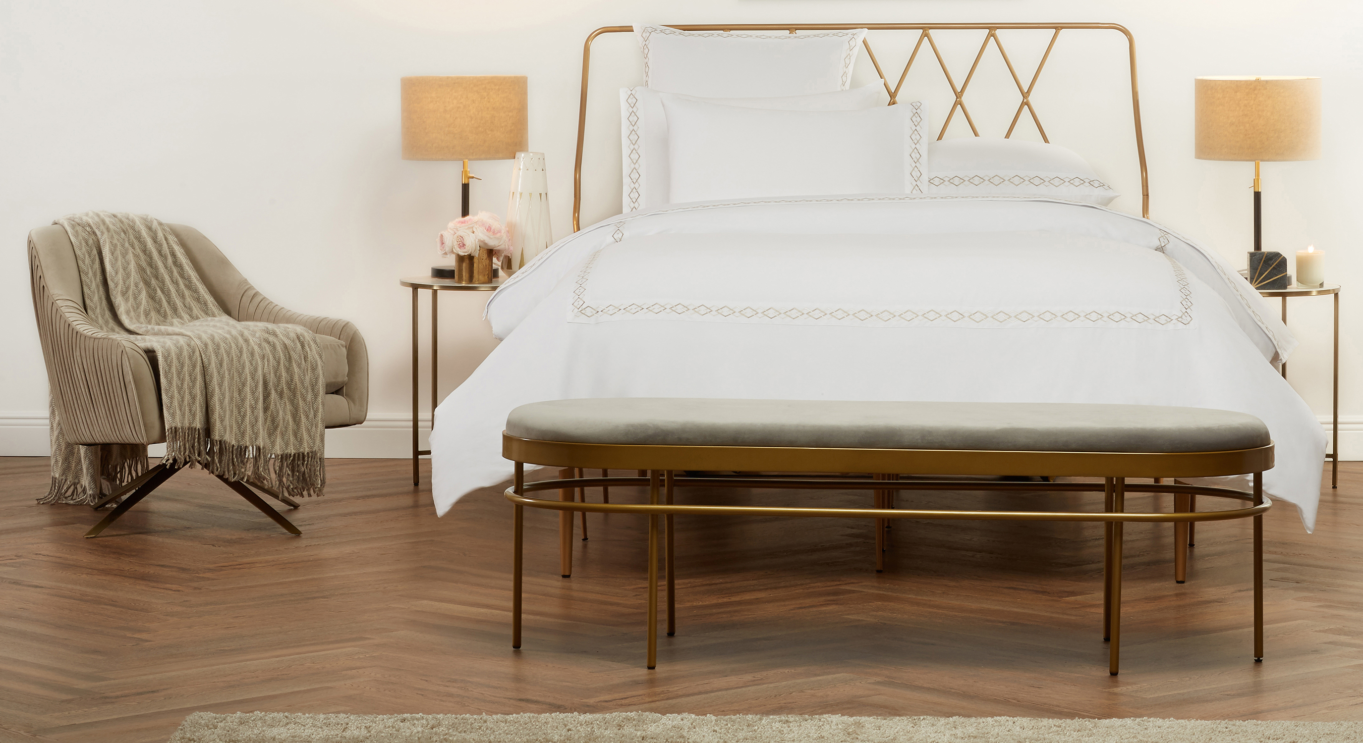 A bed that has been styled by a professional bedding photo stylist