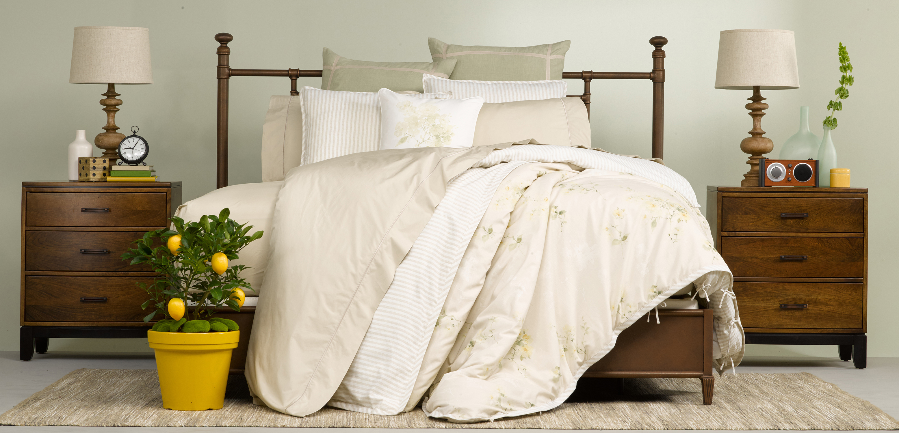 A bed that has been styled by a professional bedding stylist