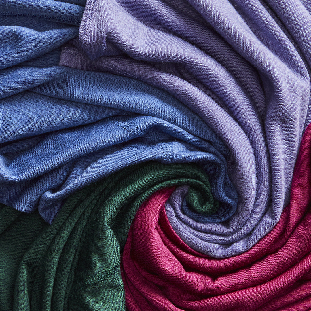 clothing items professionally displayed in a swirl pattern by an apparel photo stylist