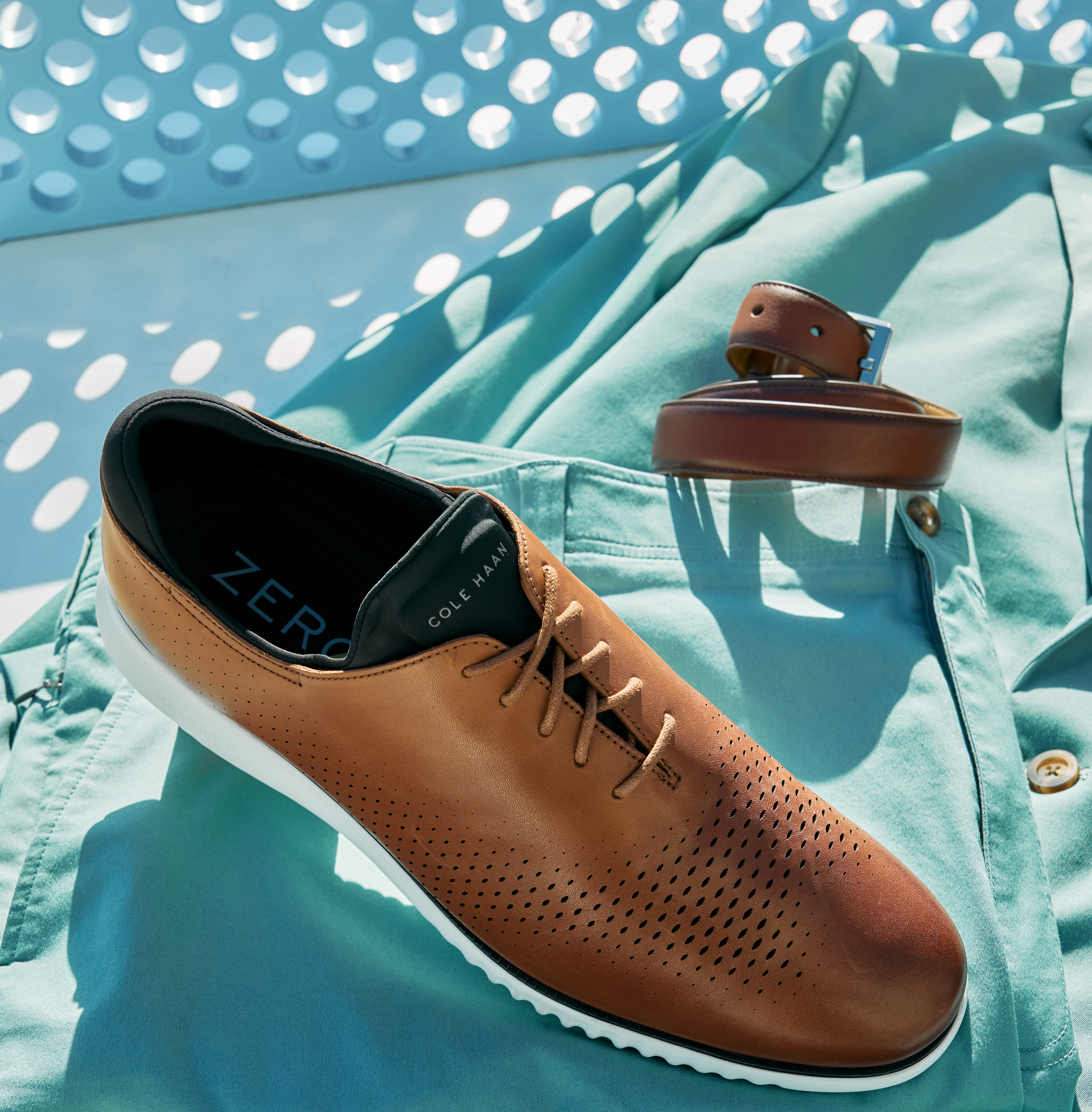 A brown, men's dress shoe that has been style by a professional footwear photo stylist