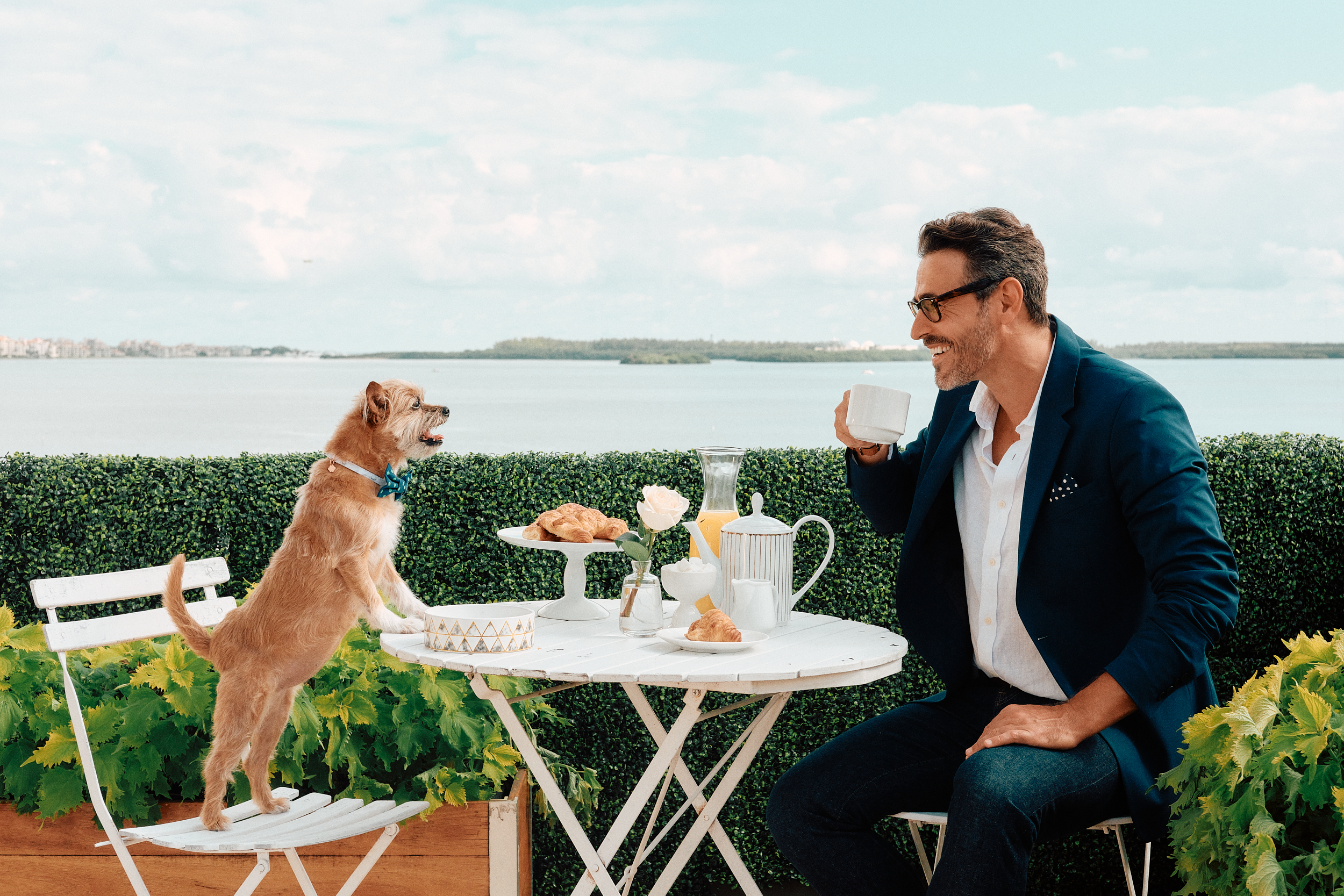 model and a dog posing for a photo shoot on a set that was styled by a professional prop stylist