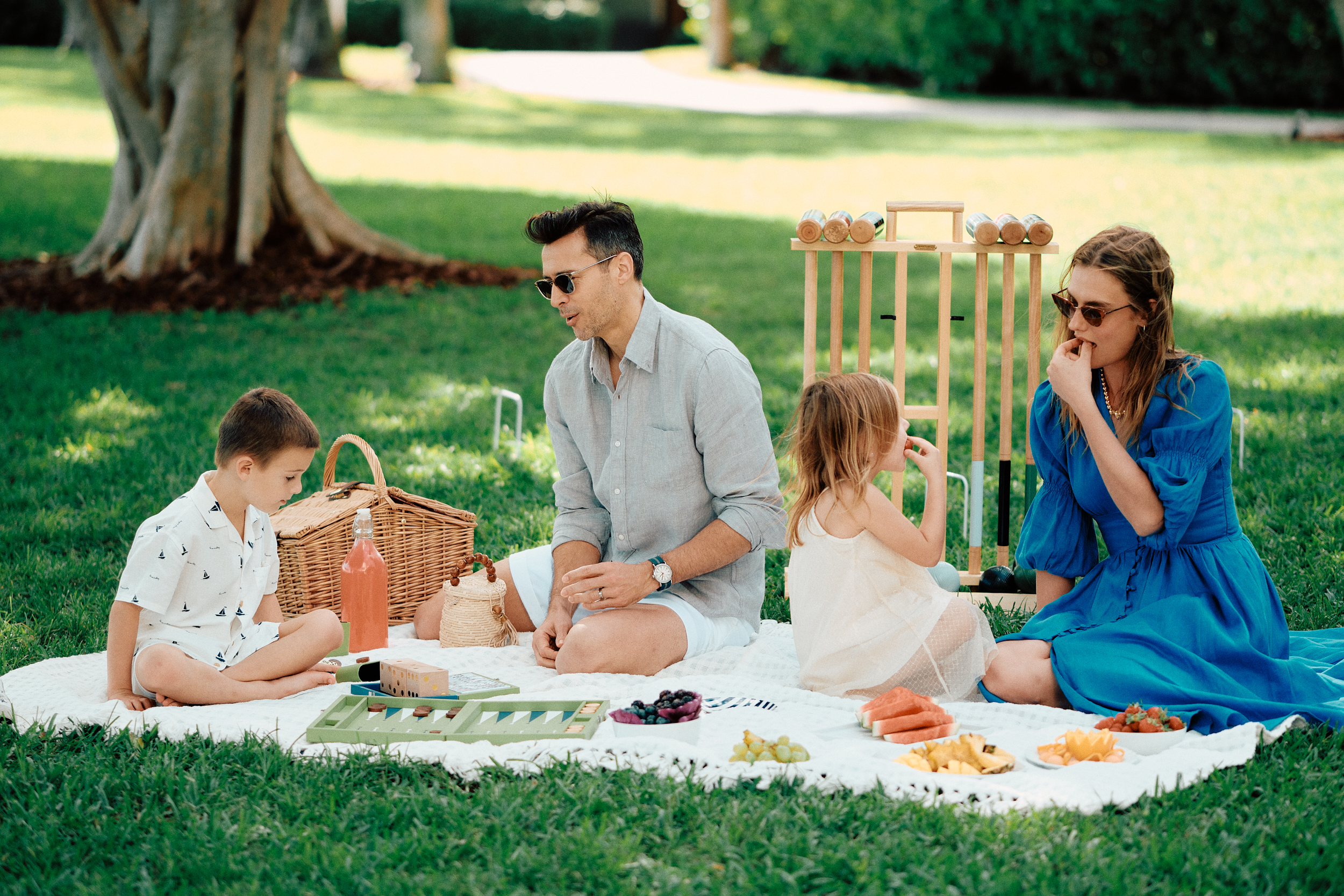 models posing for a photo shoot on a picnic set that was styled by a professional prop stylist