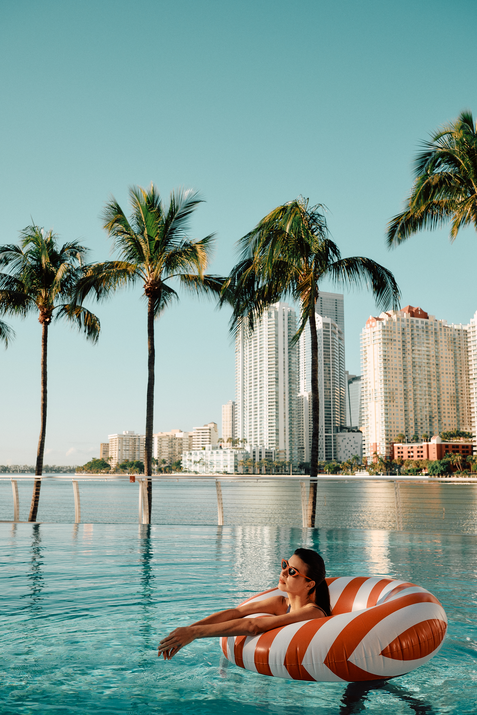 model posing in a pool for a photo shoot on a set that was styled by a professional prop photo stylist