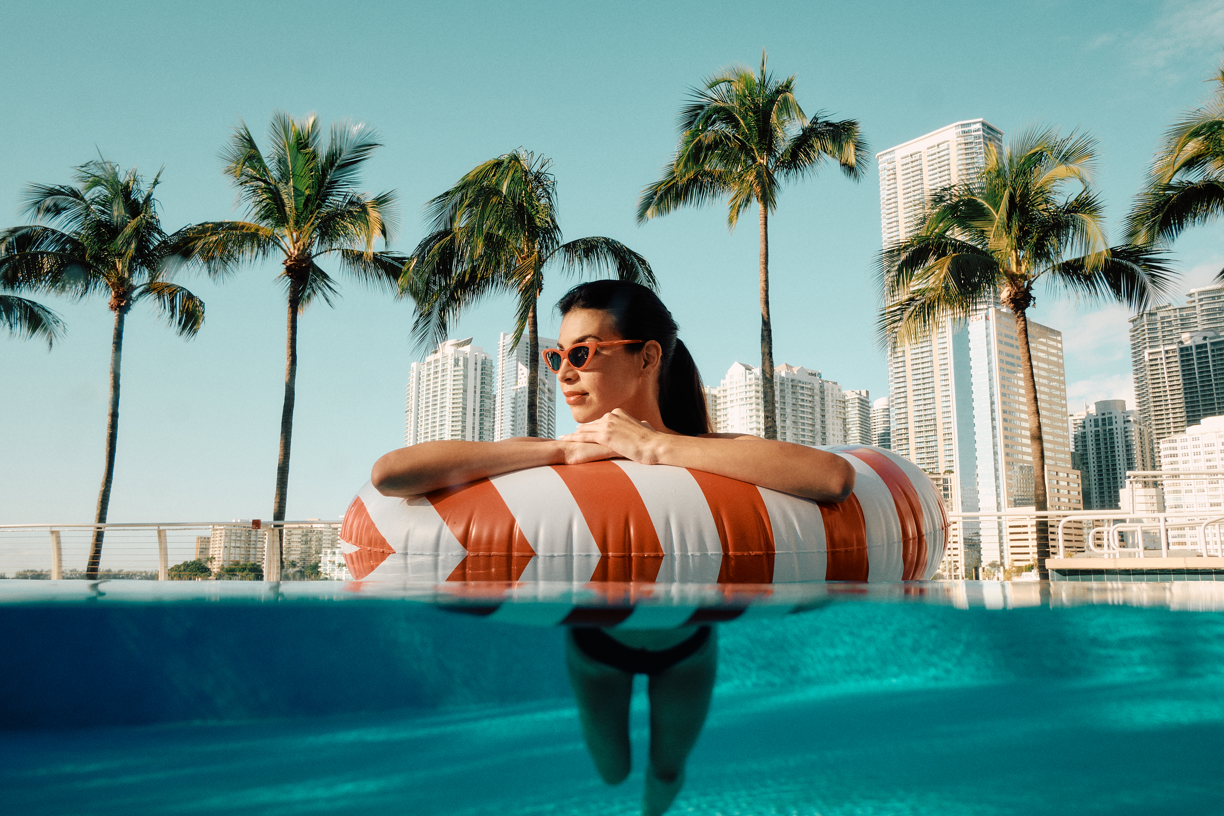 model posing in a pool for a photo shoot on a set that was styled by a professional prop photo stylist