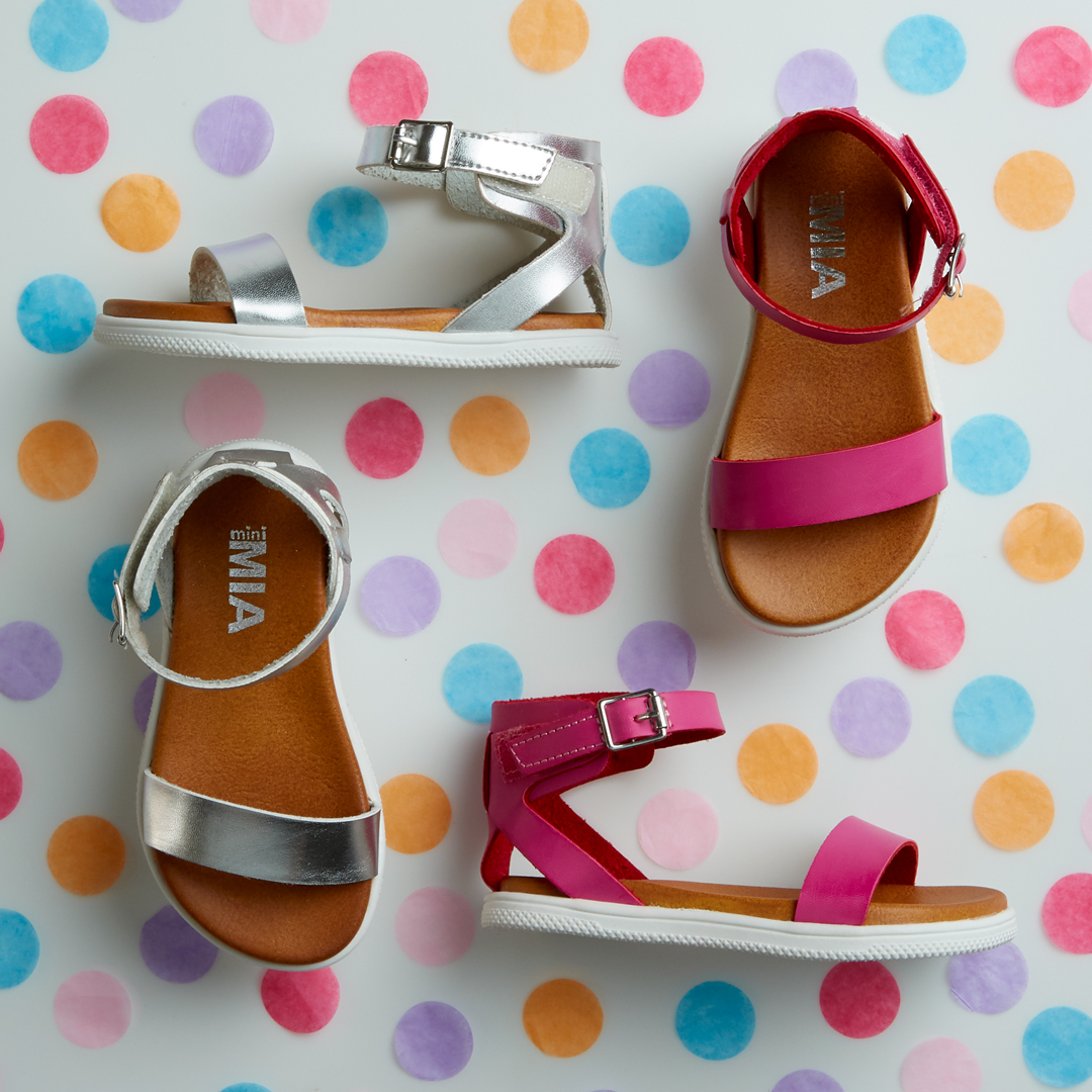 Assorted children's sandals that have been styled by a professional footwear photo stylist