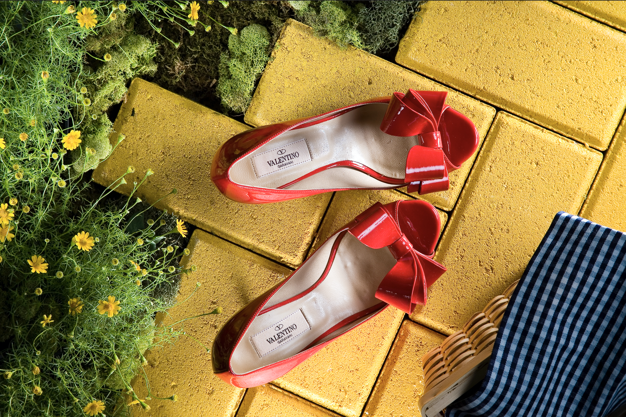 Women's red dress shoes that have been styled by a professional footwear photo stylist