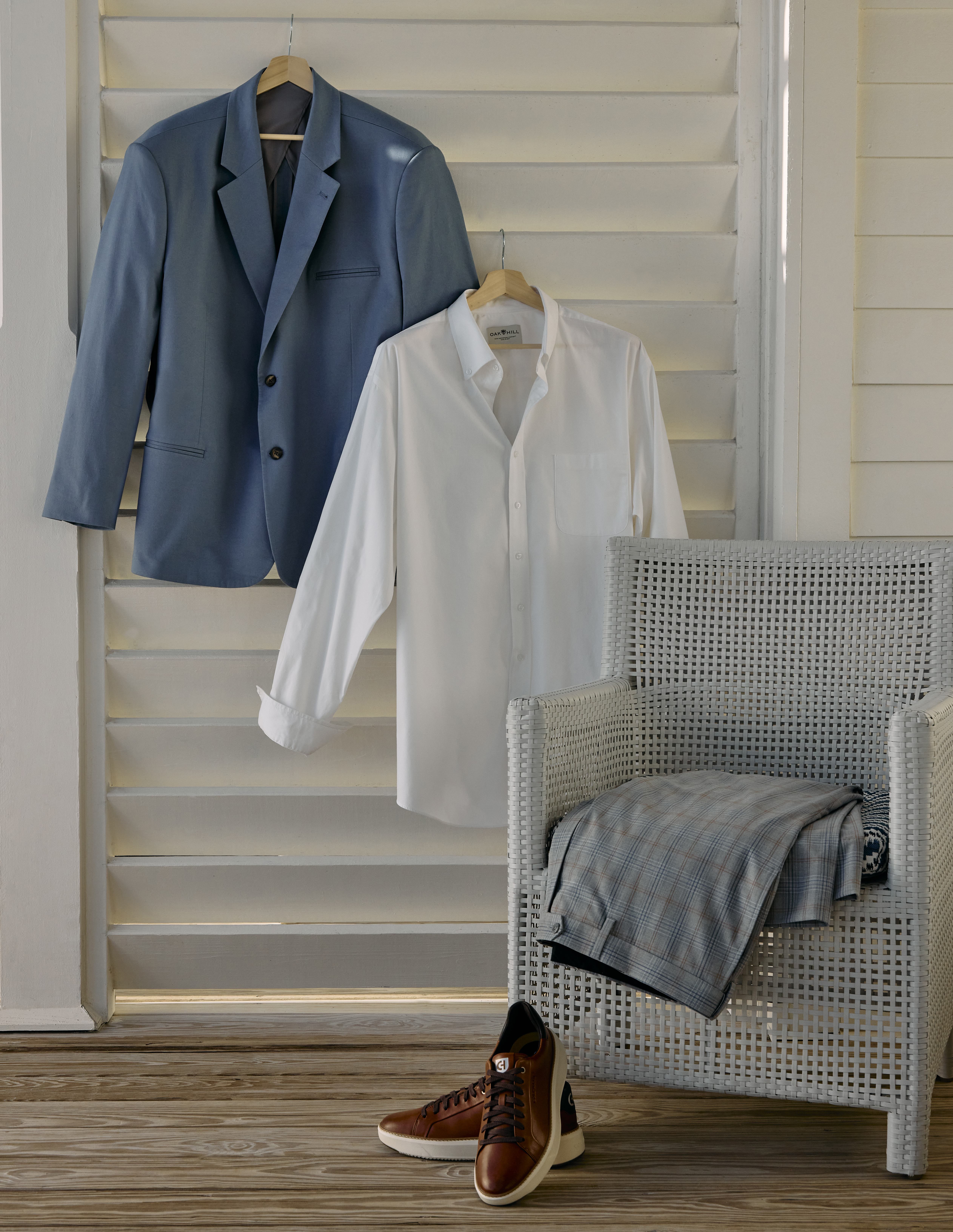 A men's dress jacket and shirt professionally displayed by an apparel photo stylist