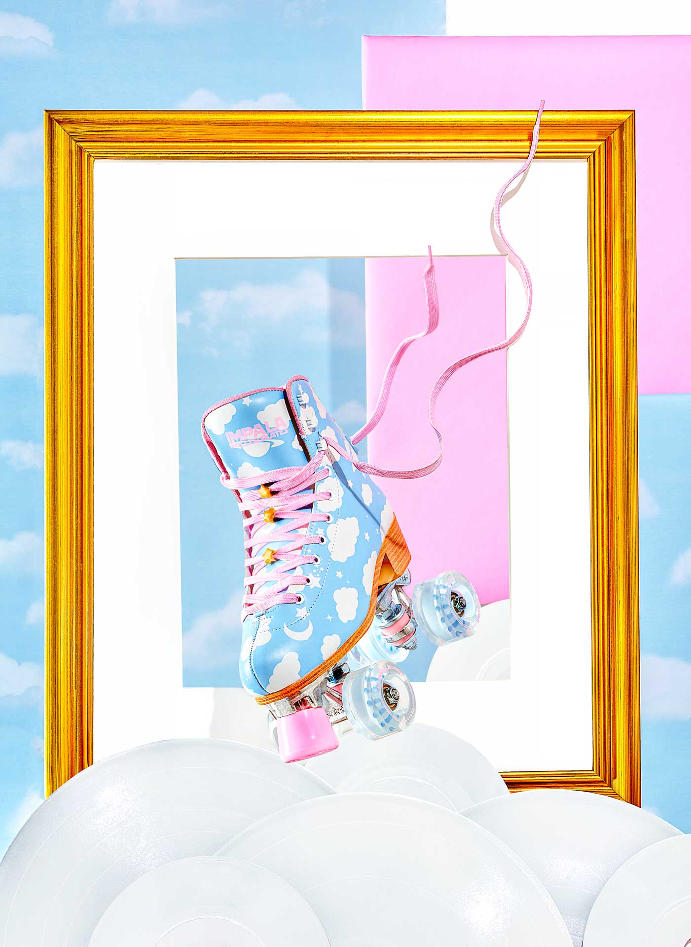cloud blue rollerblades that have been professionally styled by a footwear photo stylist