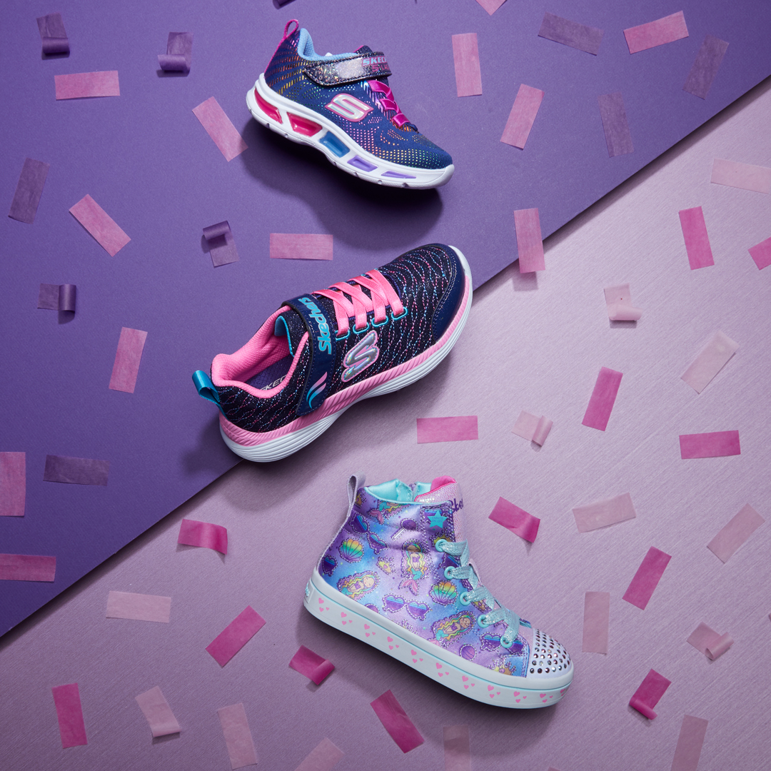 Assorted Kids Skechers that have been professionally styled by a footwear photo stylist